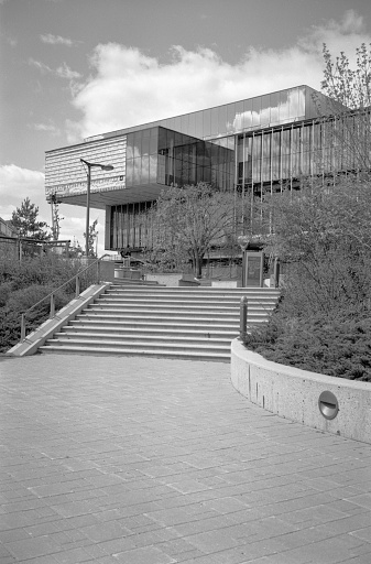 Saskatoon, Canada - May 21, 2016: This is the unfinished Remai Modern Art Gallery along River Landing and the South Saskatchewan River in downtown Saskatoon.  The building is expected to be complete in 2017. Vertical black and white image taken with a medium format film camera. 
