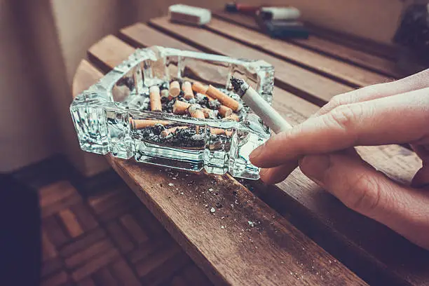 Photo of Man smoking a cigarette