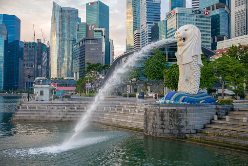 Singapore, Singapore - May 21, 2016: silhouette of Merlion Statue at Marina Bay against the sunrise. Merlion is a well known marketing icon of Singapore depicted.