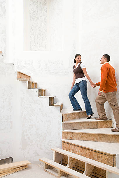istock Couple walking up stairs 534025217