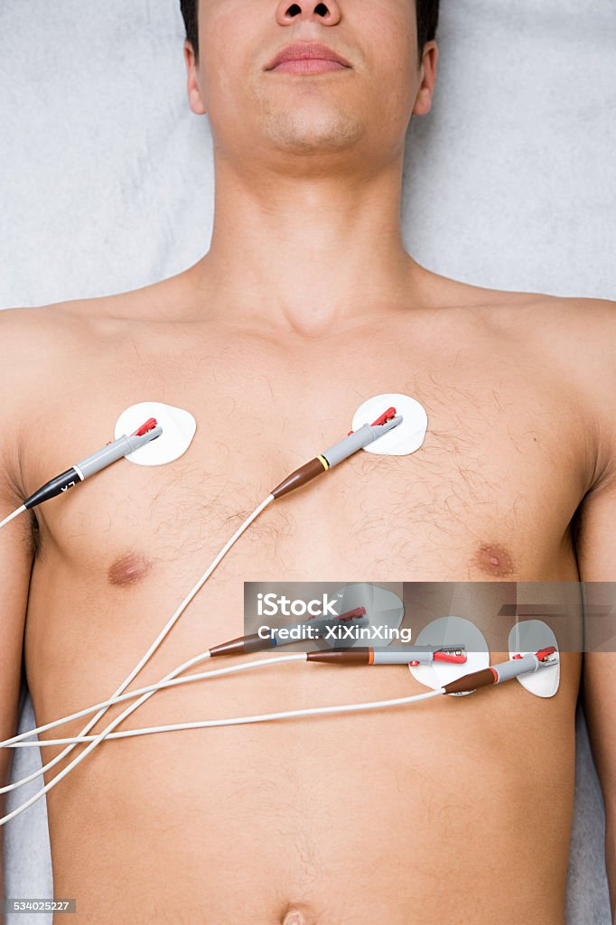 Man with electrodes on chest Electrocardiography Stock Photo