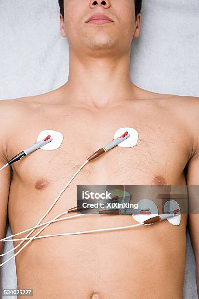 Man With Electrodes On Chest Stock Photo - Download Image Now - Electrocardiography, Electrode, Medical Exam