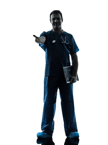 istock doctor man silhouette standing full length gesturing handshake 534025481
