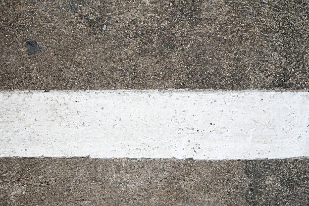 istock white line on gray concrete floor 534027881