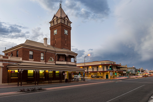 Broken Hill, Australia - August 16, 2013: Broken Hill Post Office at twilight, New South Wales, Australia. The Post Office was built in 1892. In the background the Royal Exchange Hotel. Photographed against dramatic dark sky. 