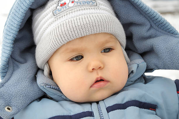 istock Child portrait in winter overall 534028393