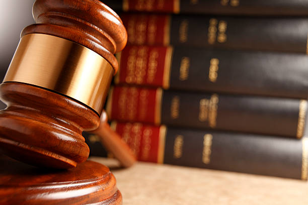 istock Gavel In Front Of Stack Of Law Books 534028690