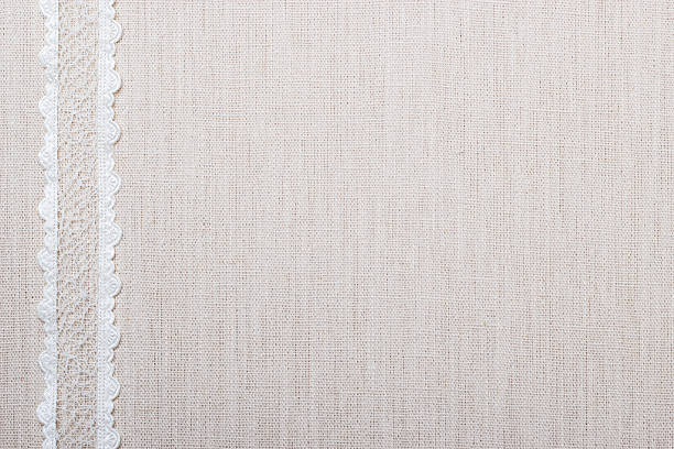 istock Lace ribbon on linen cloth background 534028713