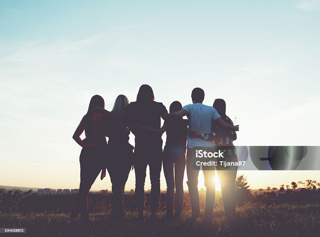 Group of people having fun outdoors; sunset Group of people having fun outdoors; sunset  20-29 Years Stock Photo