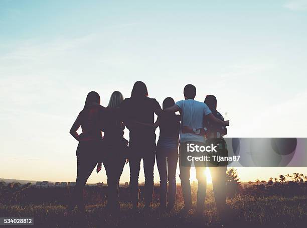 Group Of People Having Fun Outdoors Sunset Stock Photo - Download Image Now - 20-29 Years, Activity, Adult