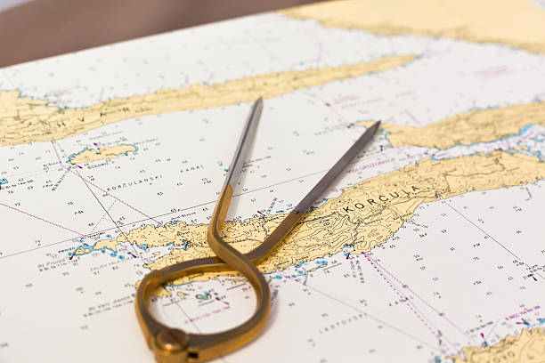 istock Pair of compasses for navigation on a sea map 534029079