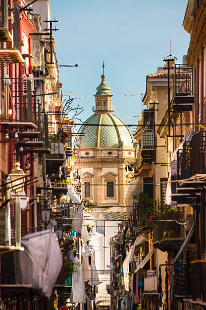 Traditional Italian medieval narrov street in Plermo. View at the church of San Matteo located in heart of Palermo, Italy, Europe;  tarditional Italian medieval city center with typical narrow residential street. palermo sicily stock pictures, royalty-free photos & images