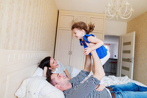 istock Parents having fun with their cute little daughter 534029612