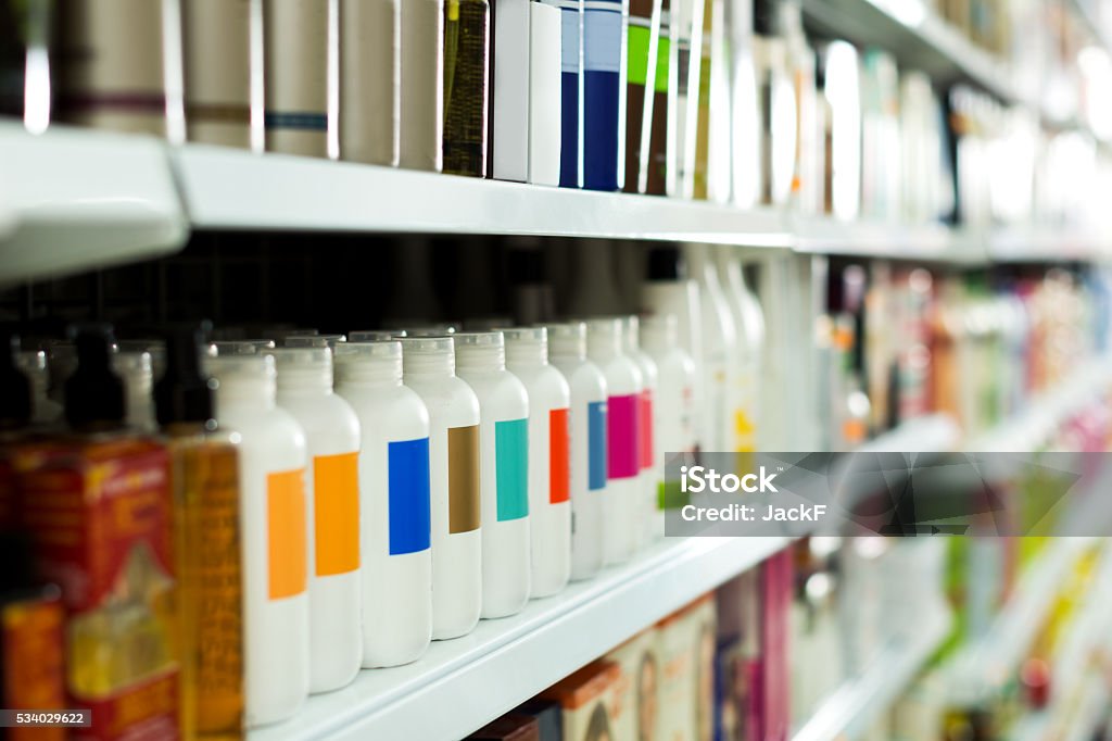 Cosmetic section with conditioners Cosmetic section with conditioners, shampoo and hair treatment in store Merchandise Stock Photo