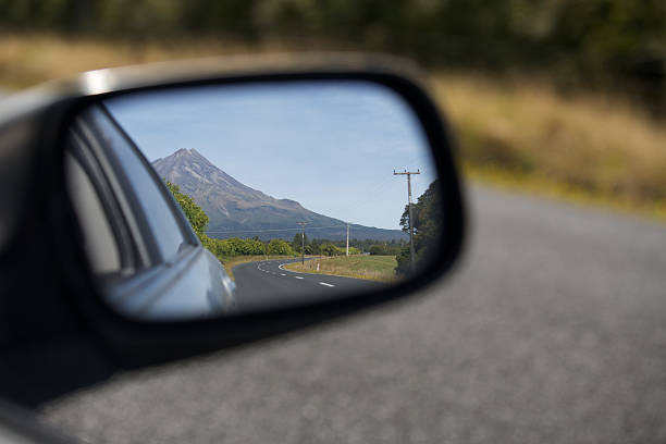Mount Taranaki/Egmont in car side wing mirror stock photo