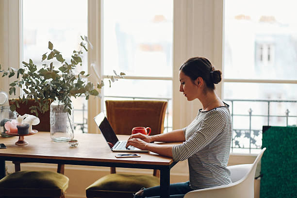 istock Young freelancer woman working in her Parisian apartment 534032374