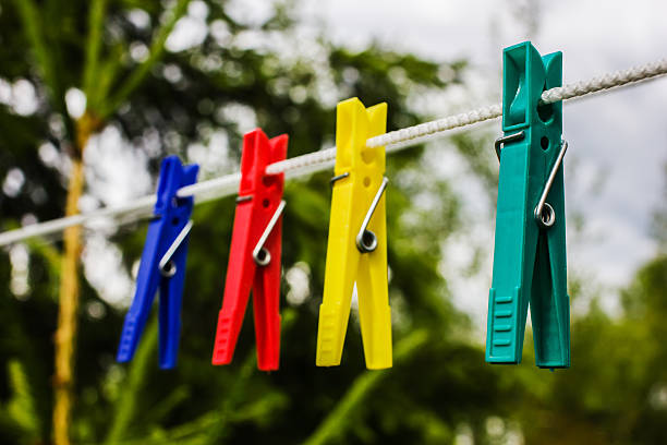 istock Colorful clothespins hanging on a rope 534032702