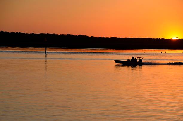 istock Fishermen returning from fishing at sunset 534032784