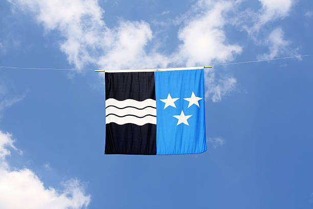 Swiss Canton Flag Series: Aargau. The three wavy lines stand for three rivers through this canton, the stars stand for three boroughs. the black color for rich earth, the blue for sky over it. aargau canton photos stock pictures, royalty-free photos & images