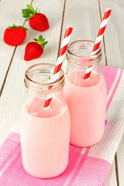 istock Strawberry milk in bottles on table 534033767
