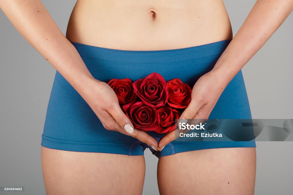 Woman body Intimate part of a woman's body with roses Women Stock Photo