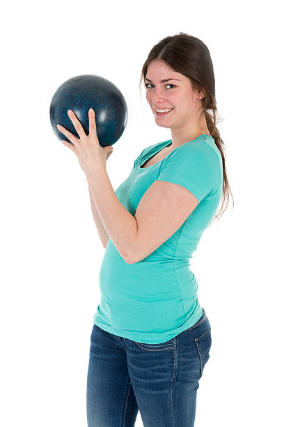 istock Pretty woman with bowling ball isolated on white 534034691