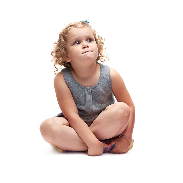 istock Young little girl sitting over isolated white background 534035548