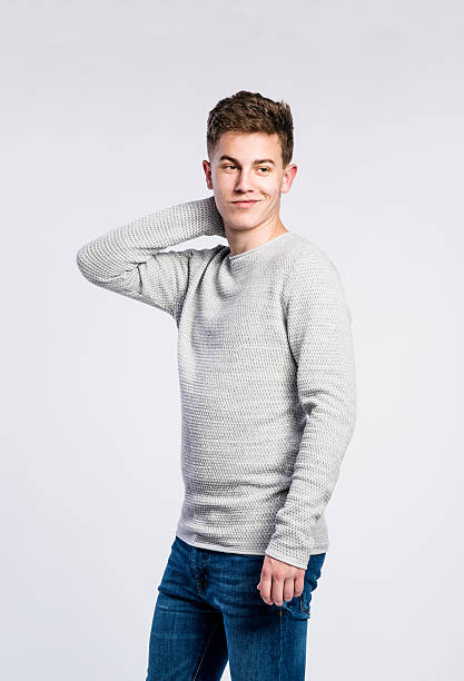 istock Boy in jeans and sweater, young man, studio shot 534037012