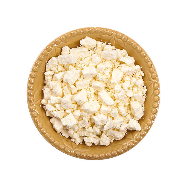 Feta Crumbled Cheese Feta Crumbled Cheese Isolated on White. Selective focus. feta cheese block stock pictures, royalty-free photos & images