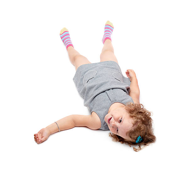 istock Young little girl lying over isolated white background 534045238