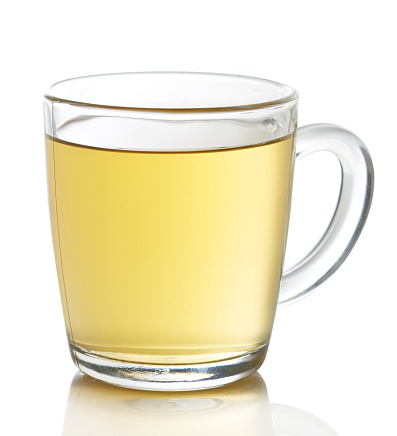 Cup of hot ginger lemon tea isolated on white background