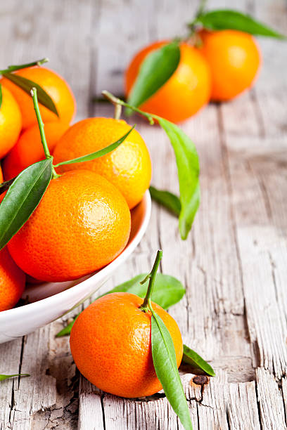 fresh tangerines with leaves stock photo