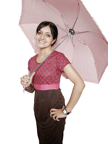 istock Pretty Indian woman smiling with umbrella over white. 534047129