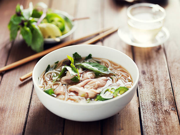 istock vietnamese beef pho with chopsticks on wooden table 534048106