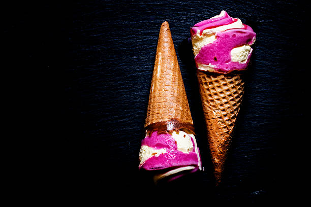 istock Strawberry and vanilla ice cream in a waffle cone, 534048578