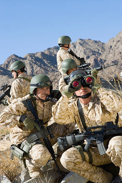 istock Soldiers With Rifles And Binocular Patrolling During War 534049165