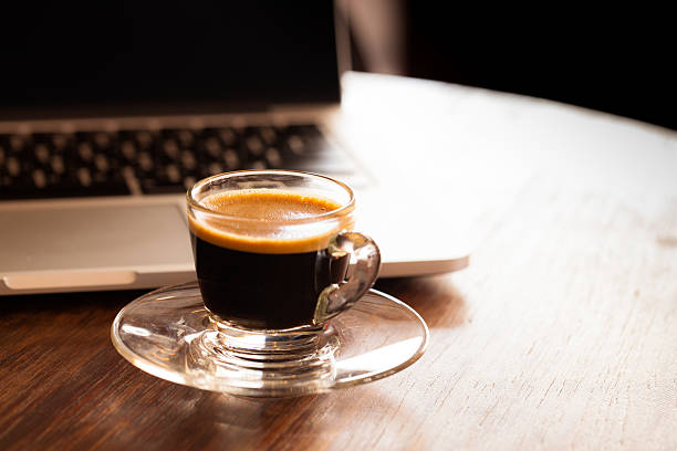 istock cup of espresso on a wooden background table. 534049817