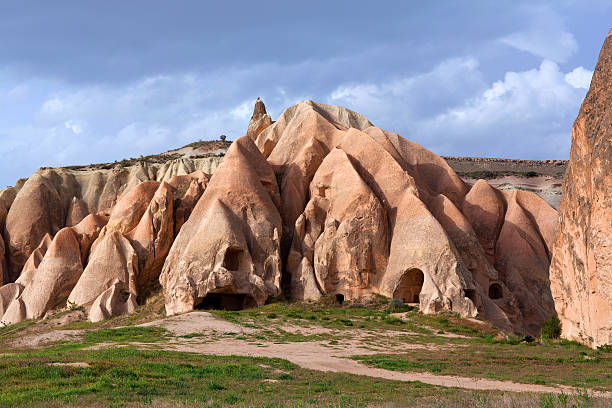 Unique geological formations in Red Valley, Cappadocia, Turkey Ancien stone church in Red Valley, Cappadocia, Turkey. Cappadocian Region with its valley, canyon, hills located between the volcanic mountains Erciyes, Melendiz and Hasan. rock hoodoo stock pictures, royalty-free photos & images