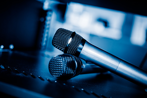 closeup view of microphone,still life,blue toned image.