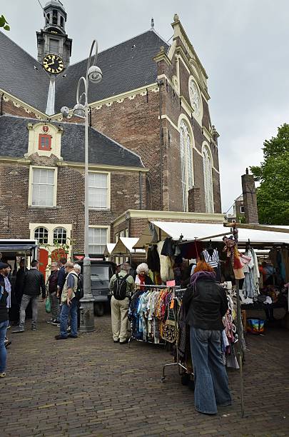 The weekend market at the Northern Market Amsterdam, Netherlands - May 21, 2016: View of the weekend flee market at the Nothern Market (Noordermarkt), in the side of the Northern Church (Noorderkerk), in the Jordaan disctrict. jordaan amsterdam stock pictures, royalty-free photos & images
