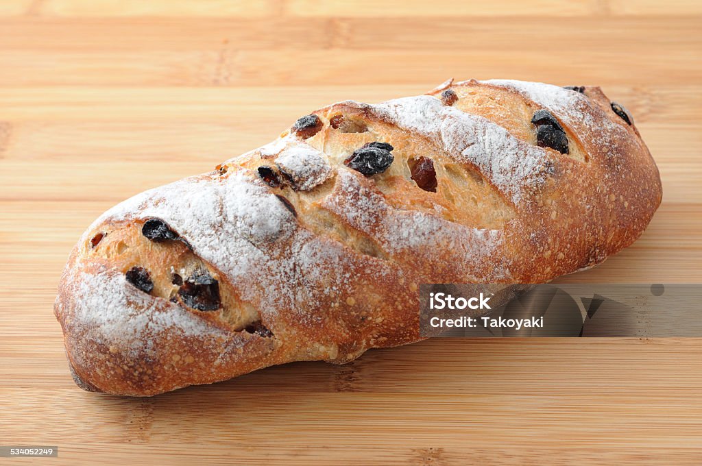 French Baguette Bread with raisin isolated on cutting board 2015 Stock Photo