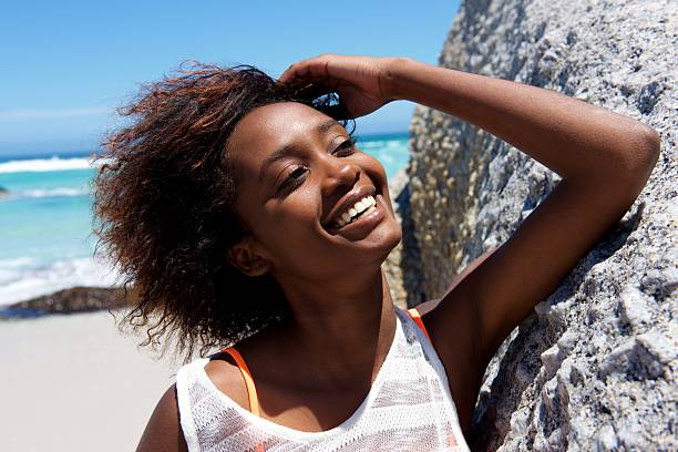 istock Cheerful young african woman outdoors at the beach 534052372