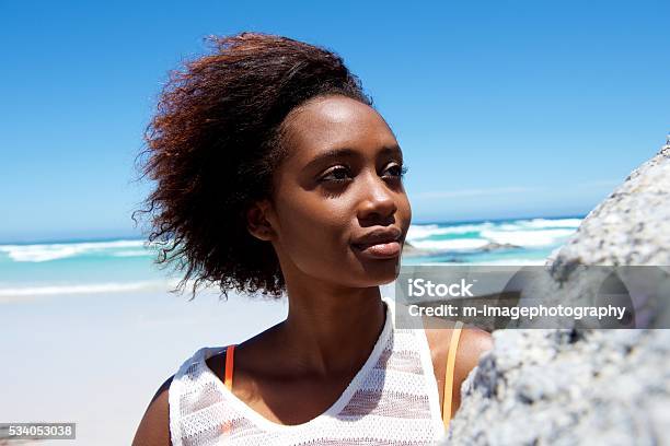 Beautiful young african woman outdoors at the beach