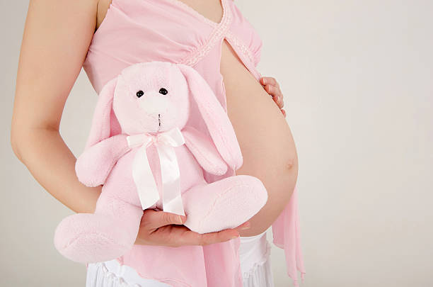 istock Close up on pregnant belly with toy. 534053107