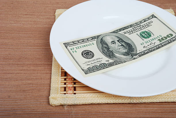 istock American US Dollar money on white plate 534053637