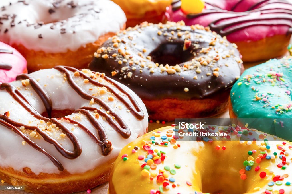 donuts in multicolored glaze close-up Doughnut Stock Photo