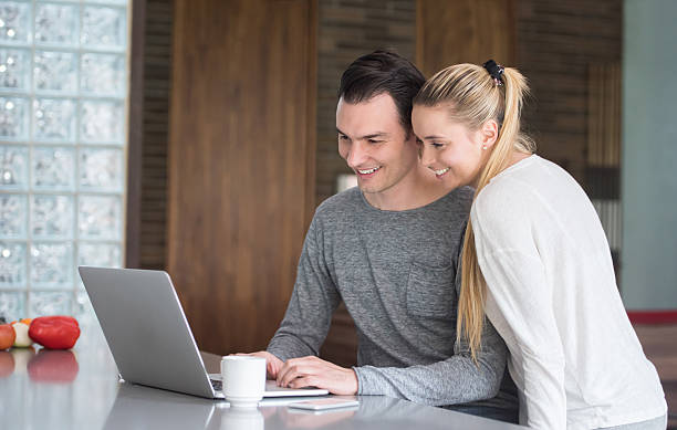istock Couple paying bills online at home 534055800