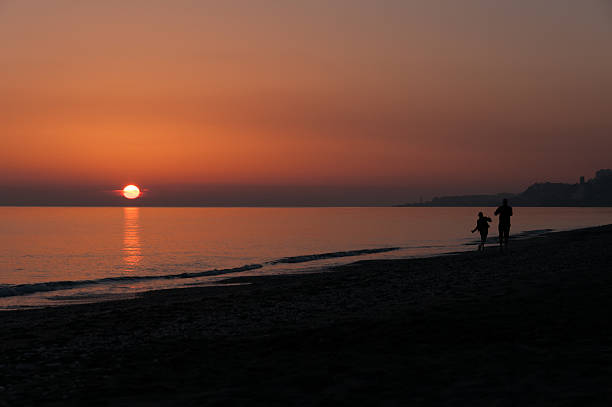 istock Silhouette Couple Beach Sunset 534056066