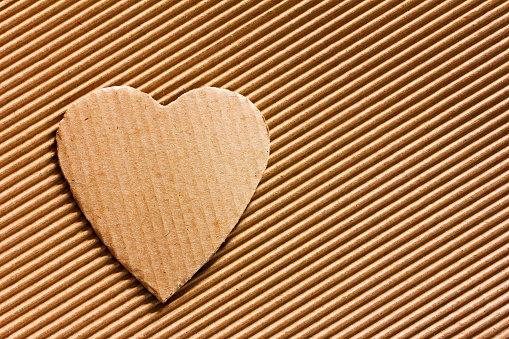 Valentine - heart symbol carved out of corrugated cardboard. Copy space. Free space for text, Close-up, top view
