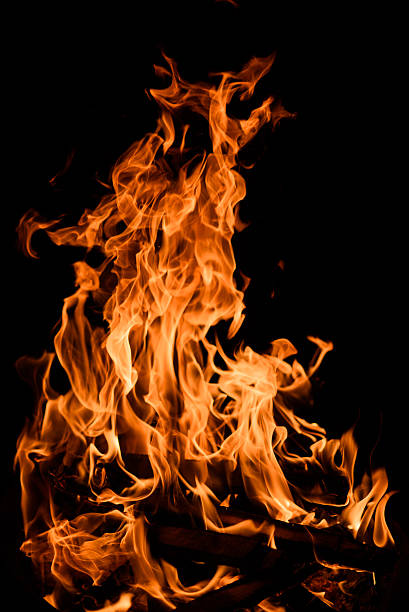 istock Orange fire flames isolated on black background 534056198